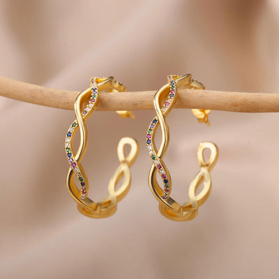 Julenyssa | Wellenohrringe aus 18K Gold