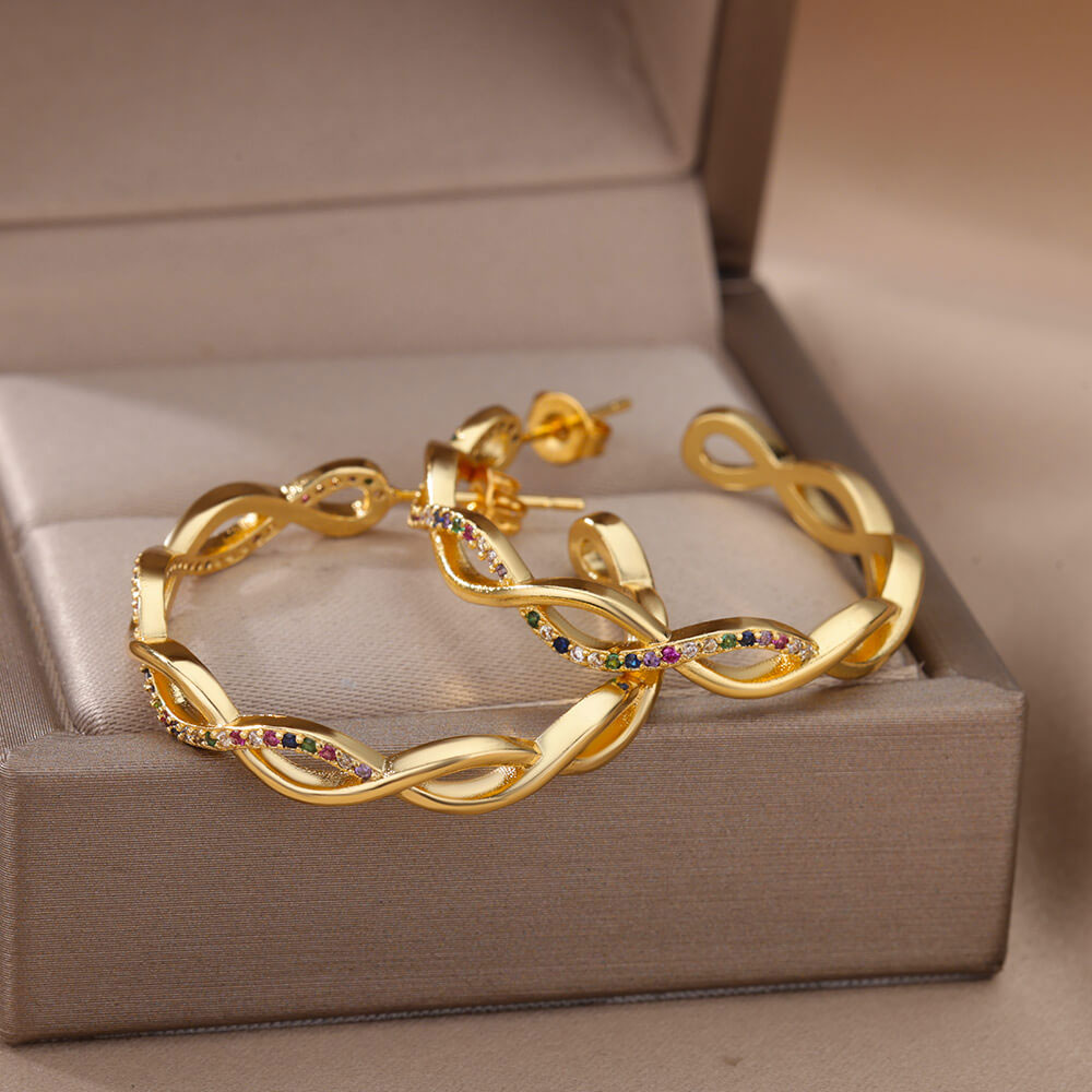 Julenyssa | Wellenohrringe aus 18K Gold
