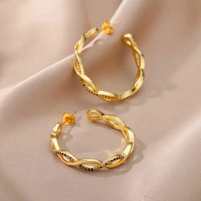 Julenyssa | Wellenohrringe aus 18K Gold